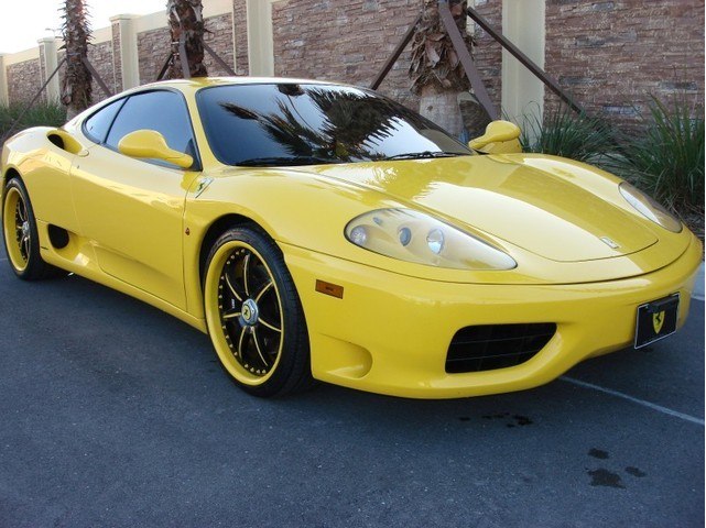 It's a 2000 Ferrari 360 Modena F1 Yellow with black interior